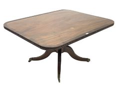 George III mahogany tilt top supper table, rosewood cross banded top over turned and gadroon carved