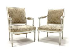 19th century white painted open armchair with bow fronted seat on fluted turned supports and another