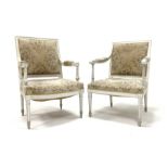 19th century white painted open armchair with bow fronted seat on fluted turned supports and another