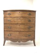 Early 19th century mahogany bow fronted chest of four long drawers on shaped apron and splay support