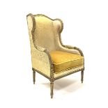 19th century giltwood wing back armchair with leaf and bead carved decoration on fluted turned suppo