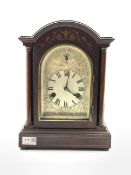 20th century dome top mantel clock, the case with floral and string inlay, silvered dial with Roman