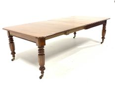 Victorian mahogany extending dining table with two additional leaves, raised on turned supports and