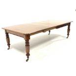 Victorian mahogany extending dining table with two additional leaves, raised on turned supports and