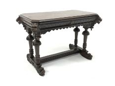 Victorian Gothic revival oak centre table, rectangular top with canted corners embellished with lion