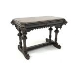 Victorian Gothic revival oak centre table, rectangular top with canted corners embellished with lion