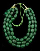 Large three strand earth mined carved oval emerald bead necklace