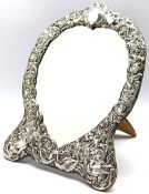 Edwardian silver heart shape dressing table mirror with embossed bird and scroll decoration