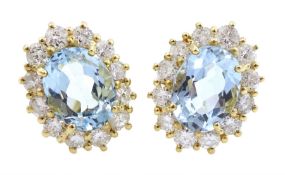 Pair of 18ct gold aquamarine and diamond cluster stud earrings