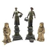 Pair of French Spelter figures after H Tremo and a pair of 19th century pottery candlesticks each mo