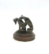 Patinated bronze sculpture of two Whippets on oval base, mounted on stepped plinth, H9cm