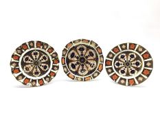 Three Royal Crown Derby Imari pattern plates no. 1128 comprising a wavy edge plate D22cm, a shaped p