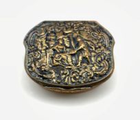 19th century gilt metal box of serpentine outline, the hinged cover embossed with figures, W7cm