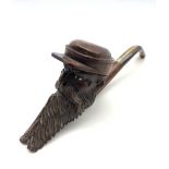 Early 20th century Briar pipe in the form of a bearded gentleman wearing a cap, inset glass eyes and