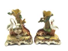 Pair of Victorian Staffordshire spill vases, each modelled as scenes from Aesop's fable The Fox and
