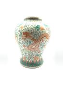 20th century Chinese vase of baluster form painted with a Dragon and Phoenix amidst scrolling foliag