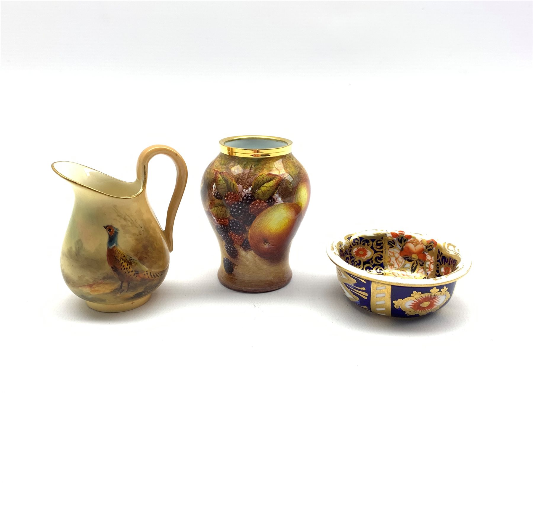 Royal Worcester miniature hand-painted jug decorated with a Pheasant in a woodland setting dated 191