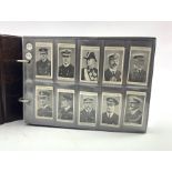 An album of military and sport related cigarette cards, part sets including Turf Cricketers, Gallahe