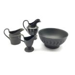 Wedgwood black basalt bowl and three jugs with engine turned decoration, H13cm max (4)