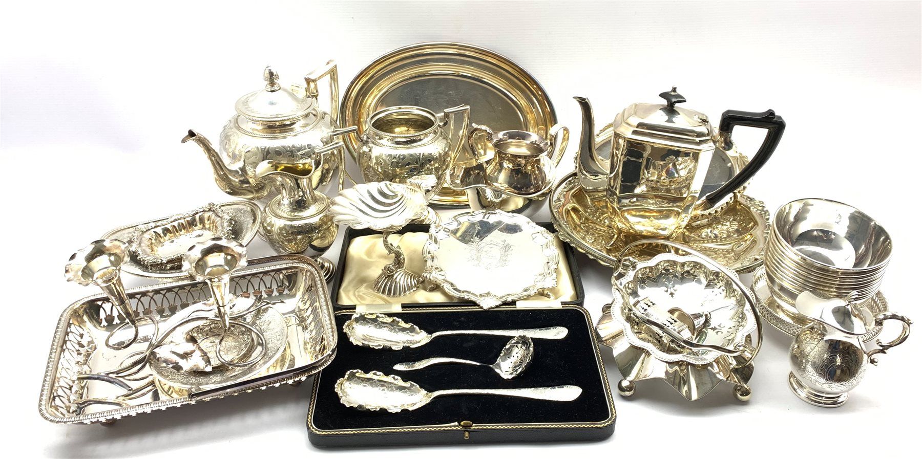 A cased early 20th century Dessert serving set comprising two foliate design spoons and sifter, all