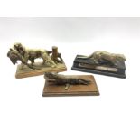 Silver plated model of an otter on wooden base with presentation inscription dated 1953 L27cm, a col