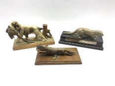 Silver plated model of an otter on wooden base with presentation inscription dated 1953 L27cm, a col