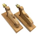 'Mouseman' pair carved oak wall sconces with mouse signature, scrolled decoration on chamfered recta