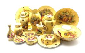 A collection of Aynsley Orchard Gold and similar ceramics including vases, bowls, milk jug, trinket