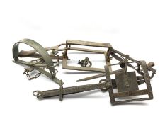 Five various vintage gin traps. These are sold for ornamental purposes only as their use is illegal