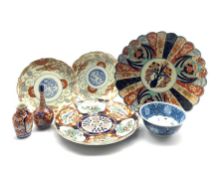 Pair of Japanese Meiji dishes, decorated with a central dragon and pearl roundel encircled by bands