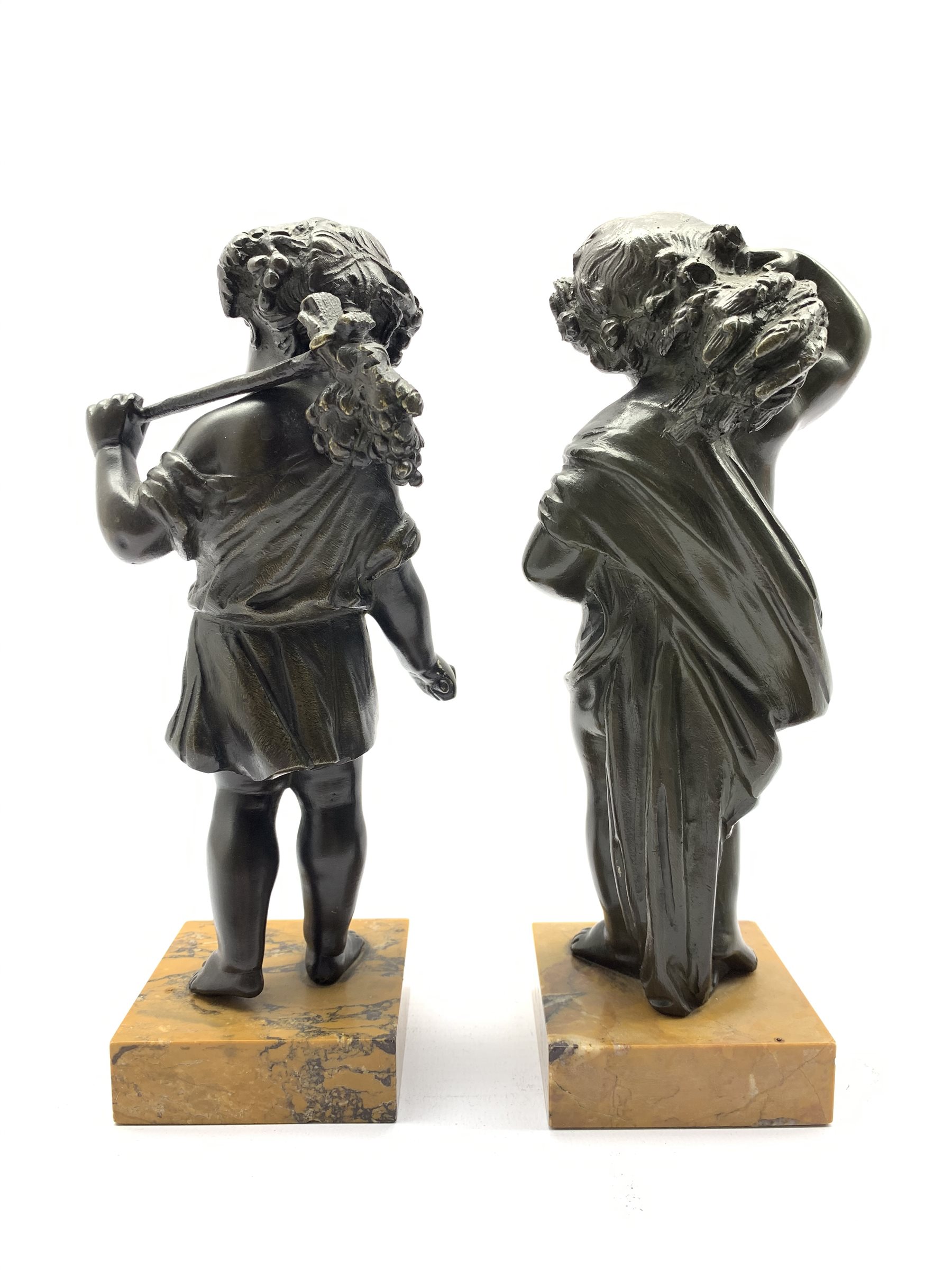 Pair of bronze figures of children, each as a standing figure holding a wheatsheaf, and the other ho - Image 2 of 2