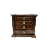 Small Victorian inlaid mahogany chest of inverted breakfront design with four long drawers on a pli
