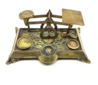 Set of late Victorian brass postal scales with cut leaf decoration 'Warranted Accurate' with four we