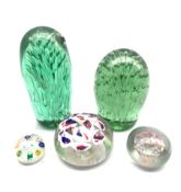 Two Victorian glass dump paperweights with bubble inclusions, H15cm a millefiori paperweight and two