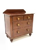Victorian stained pine chest, with raised back over two two short and two long graduated drawers