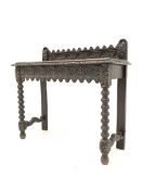 Victorian oak hall table, with raised back and frieze profusely carved with floral roundels, raised