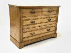 Edwardian satin walnut chest, fitted with two short and two long graduated drawers, formally a dress