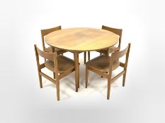 Mid 20th century teak veneered and beech circular drop leaf dining table, (D113cm, H73cm) together w