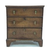 Small Georgian oak chest, fitted with three drawers and brass drop handles, raised on bracket suppor