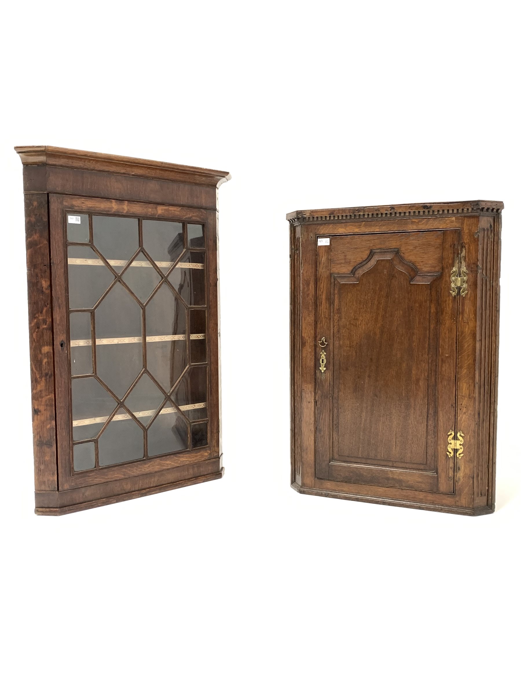 George III oak and mahogany corner cupboard, with astragal glazed door enclosing three shelves, (W78