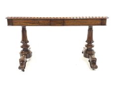 Victorian rosewood library table, the rectangular top with castellated edge and floral carved rounde