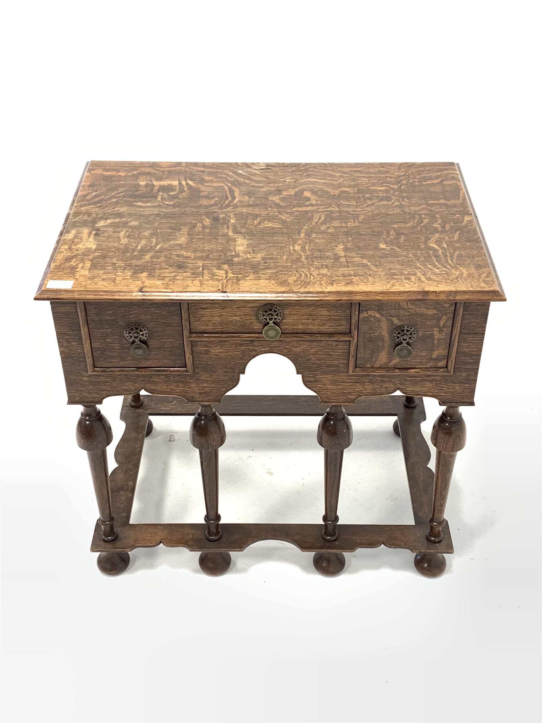 17th century style oak lowboy, fitted with three drawers, raised on turned supports united by shaped - Image 2 of 4