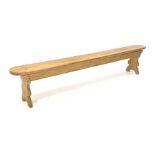 20th century pine bench raised on shaped panel end supports