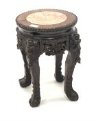 Late 19th Early 20th century Chinese hardwood jardini�re stand, rouge marble inset top enclosed by b