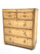 Early 20th century pine chest, fitted with two short and three long drawers, raised on bun supports