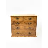 Early 20th century varnished pine chest, fitted with two short and three long graduated drawers