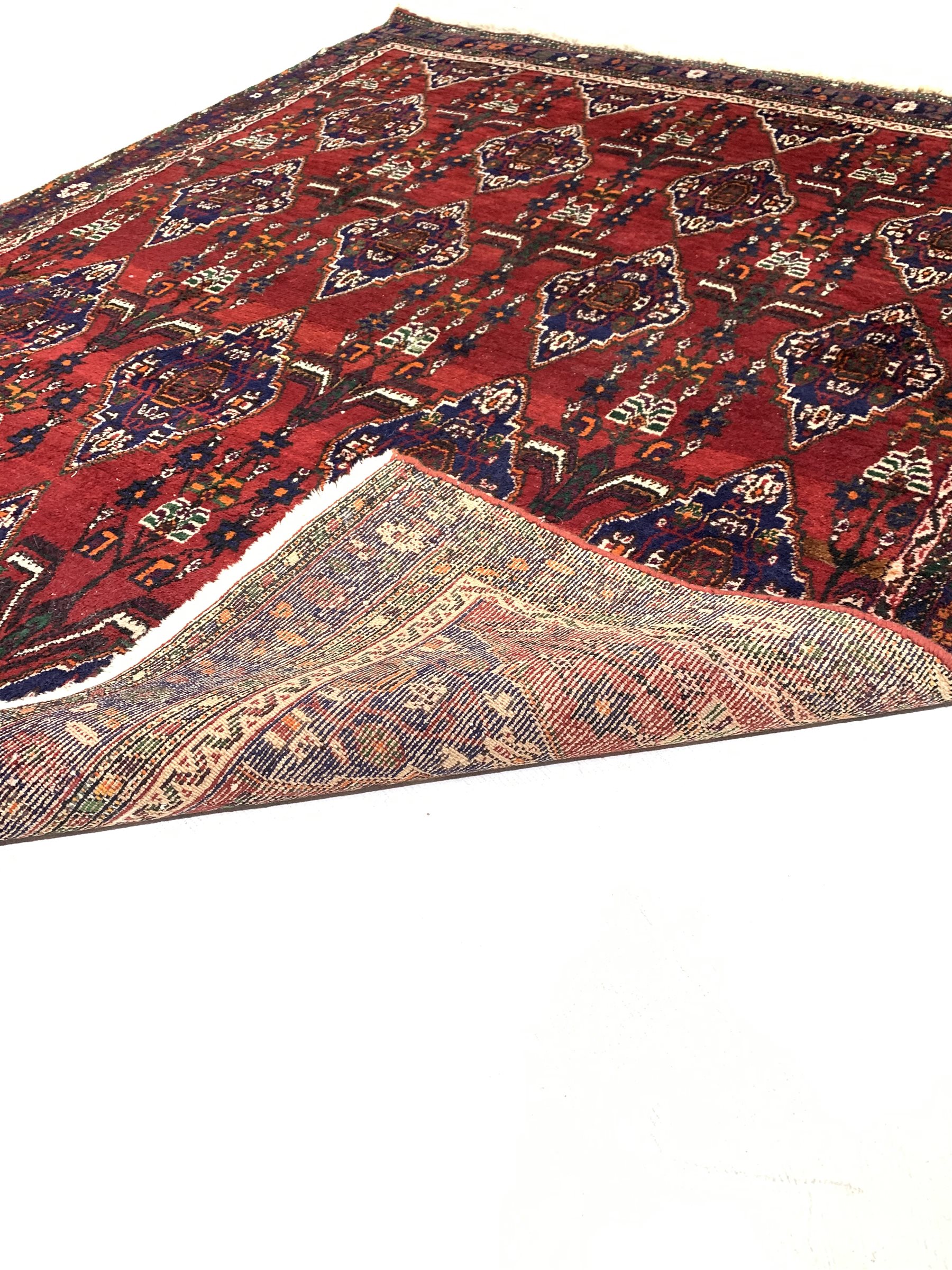 Iranian Neynz rug, red ground with multiple stylised lozenge decorated field - Image 3 of 3