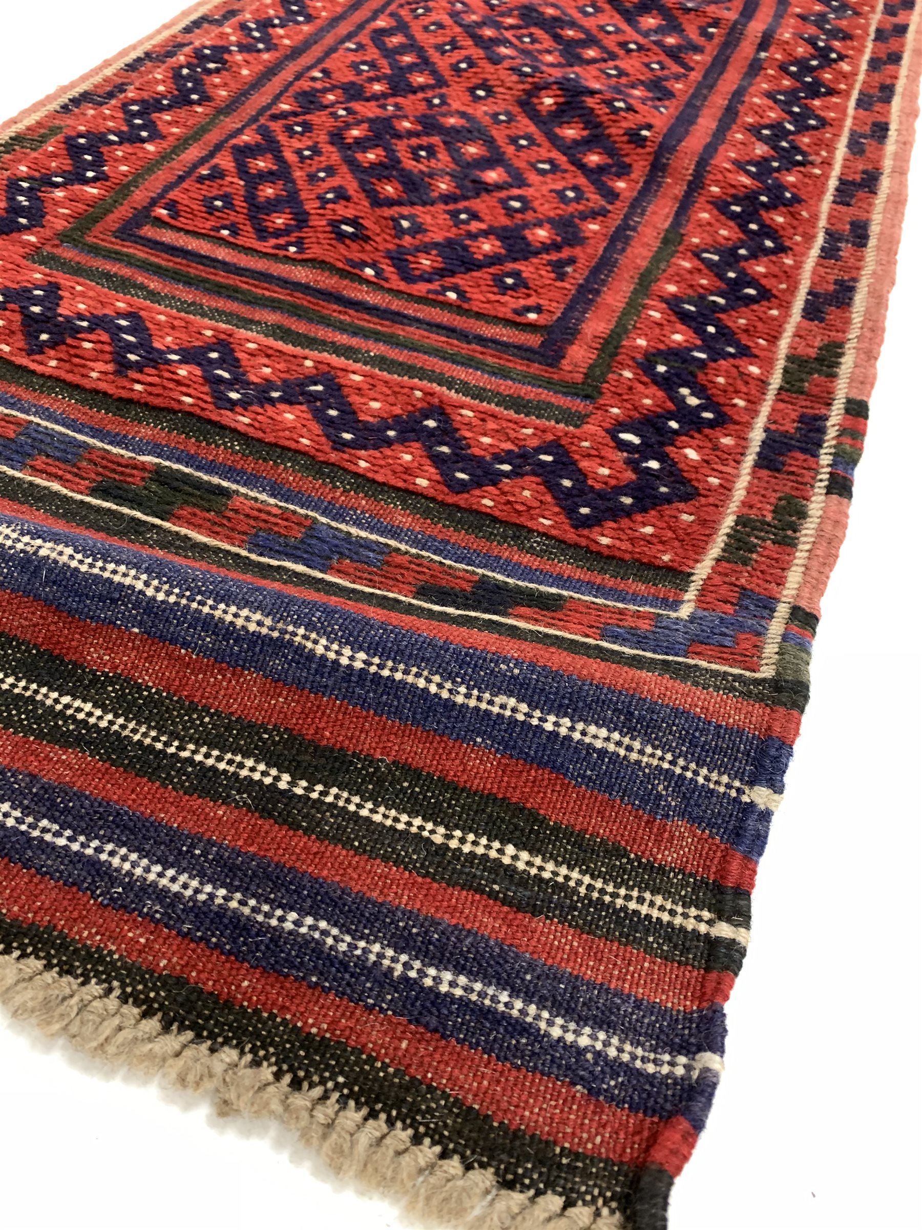 Persian runner rug, with repeating blue design on red field, (250cm x 56cm) together with a Persian - Image 2 of 5