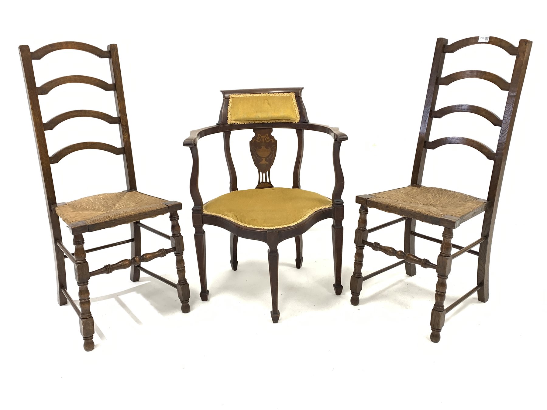 Pair of 19th century oak arched ladderback chairs, with rush seats over turned front supports and st