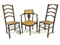 Pair of 19th century oak arched ladderback chairs, with rush seats over turned front supports and st